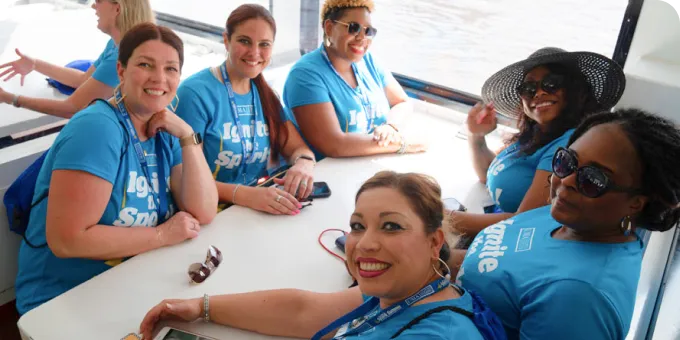 A group of people collaborating on a project together.